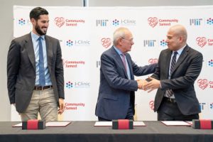 Hassan Jameel (left), President of Community Jameel Saudi Arabia, and Fady Jameel, President International (far right) of Community Jameel, congratulate L. Rafael Reif, President of MIT, at the J-Clinic launch event in September 2018.