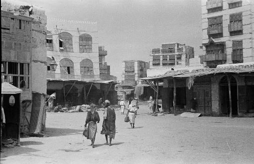 View of locals walking through a street in the city of Jeddah